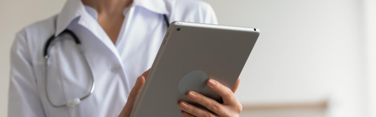 doctor uses tablet